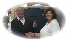 John Milich, graphic communications solutions executive, Xerox Corp.; and Joan Escover, president, JP Graphics, stand next to the new Xerox Color 1000i press.
