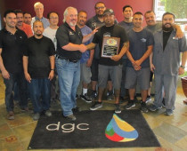 Eagle Systems President and CEO Mike King presents pressroom supervisor Gary Reyes (center right) and his D'Andrea Graphic Communications production team with their duly earned ECFC Certification Award. 