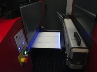 An IST Metz LED UV curing unit (right) at work on a Codimag label press.