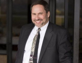 Brad Hoffman, owner of catalog printer Arandell, which filed Chapter 11 bankruptcy protection, will remain following the acquisition of Arandell by a private equity firm.