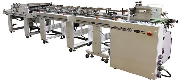 OmniFold 3000 configured for converting cartons and boxes with a friction feeder in the docking station, and IL3 converting table, IL6 converting table and a compression stacker for delivery. An optional Fold Hook kit is available for converting auto-lock bottom boxes.