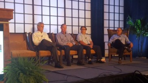 From left, Ray Mass of Colgate Palmolive, Calvin Osterberg of Rochester Midland Corp., and Patrick Poitevin of Mondelez, discuss digital printing with Kevin Karstedt of Karstedt Partners.