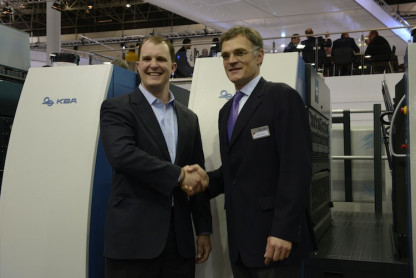 KBA Group President and CEO Claus Bolza-Sch&uuml;nemann (right), congratulates John Sommers, President and CEO of Allied Printing Services (left), at drupa in Germany on the purchase of its fourth new six-color, 41˝ KBA Rapida 106 high-performance press equipped with UV and conventional coating and running speeds of 20,000 sph.