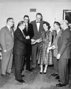 Image taken from a newspaper on March 21, 1958, when Woody Huffman (third from left) was presented a Certificate of Craftmanship. Image courtesy of McClung Cos. 