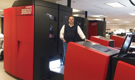 Jon Kaufman, SVP, technical development, stands next to one of Allied Printing Services new Xeikon 9800 digital presses.