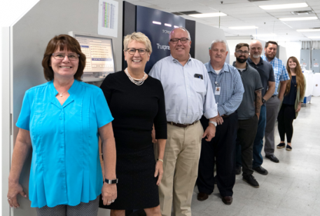 Owners Judith and Joe Maloy, second and third from left, stnad with fellow members of the Polaris Direct team.