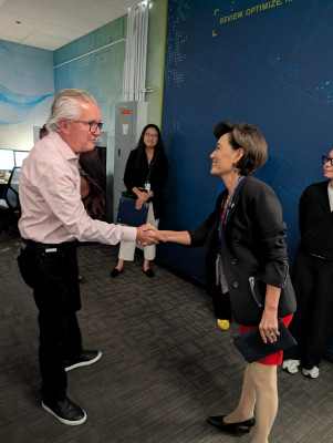 Congresswoman Young Kim shakes hands with Image Options co-founder Tim Bennett.